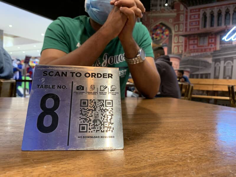 An image of a tabletop QR Code sign for restaurant ordering.